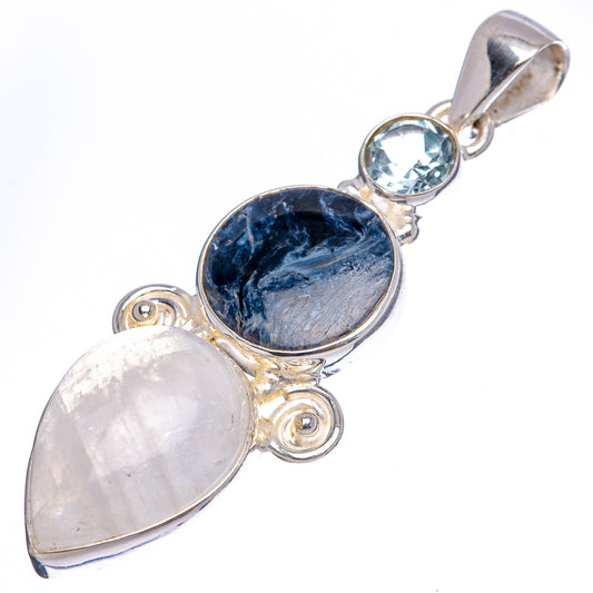 Three-stone sterling silver pendant with blue oval, moonstone-like pink, and sky-blue round