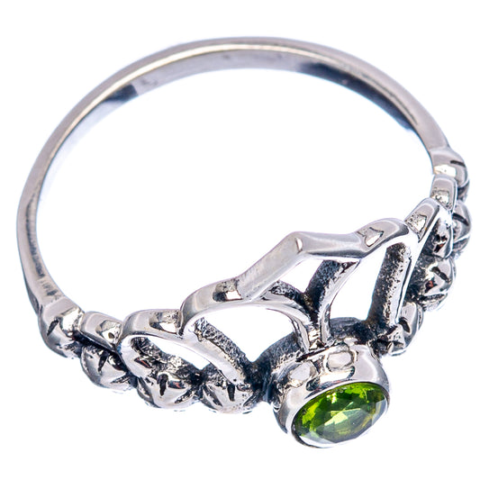 Sterling silver crown ring with green round gemstone and carved side band