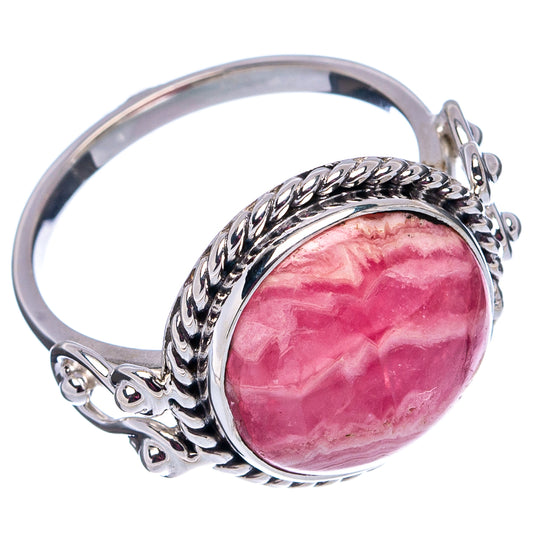 Oval rhodochrosite cabochon ring with twisted .925 sterling silver band, size 8.75