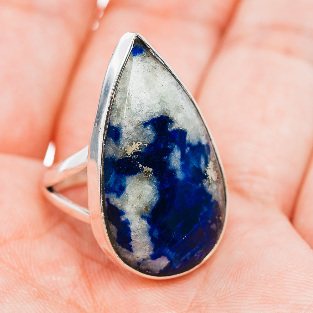 Sterling silver ring with blue teardrop gemstone centerpiece and polished band