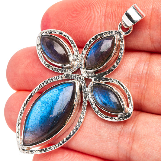 Sterling silver labradorite pendant with blue oval stones and textured bezel, top bail