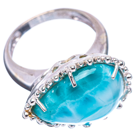 Sterling silver ring with large oval blue gemstone cabochon and two vertical prongs
