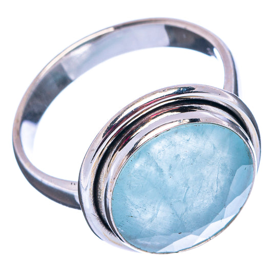 Aquamarine sterling silver ring with oval light blue gemstone and polished metal band