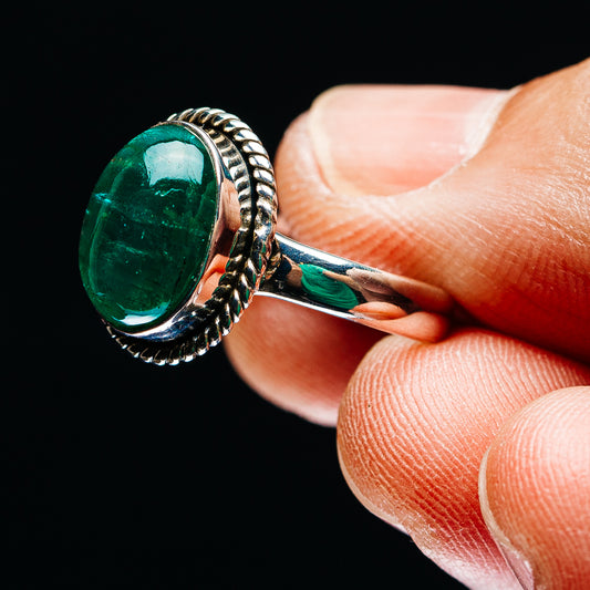 Sterling silver ring with oval green emerald cabochon and rope setting side view