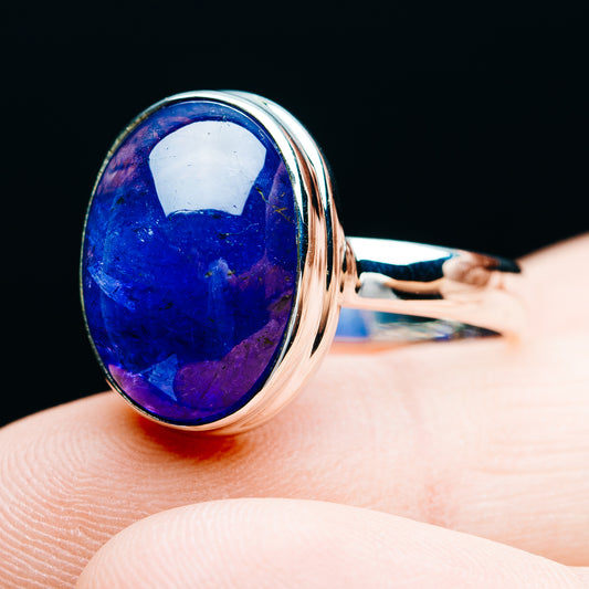 Sterling silver oval tanzanite ring with blue gemstone, side view of band