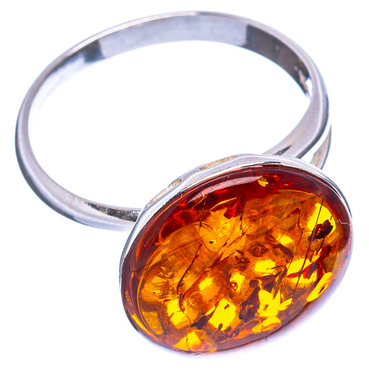 Sterling silver adjustable ring with oval amber cabochon setting