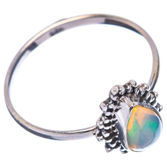 Sterling silver opal ring with oval multicolor cabochon and textured prong band
