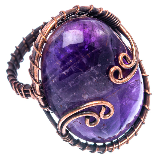 Oxidized copper wire wrap ring with purple amethyst cabochon and raised loop settings