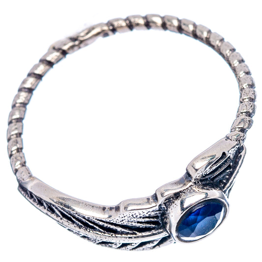 Sterling silver dainty ring with blue gemstone and feather-like metalwork