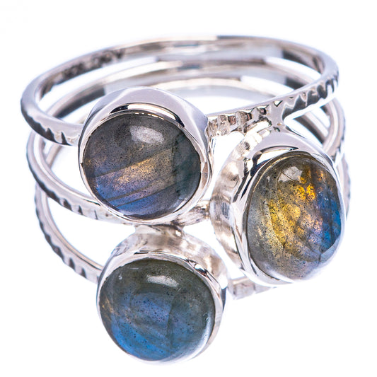 Twisted sterling silver ring with three labradorite cabochons in blue and gold flashes