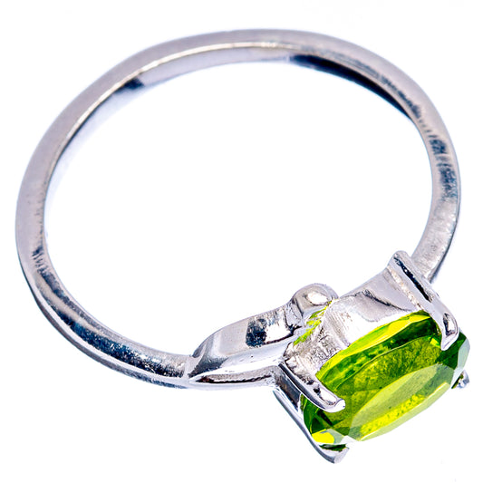 Sterling silver bird ring angled view with prong-set oval lime-green gemstone
