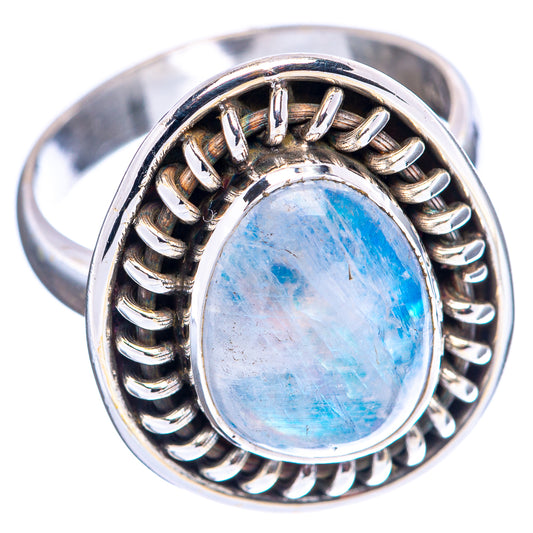 Sterling silver ring featuring oval blue cabochon moonstone and ridged halo
