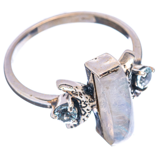 Sterling silver ring with rectangular iridescent setting and two blue stones