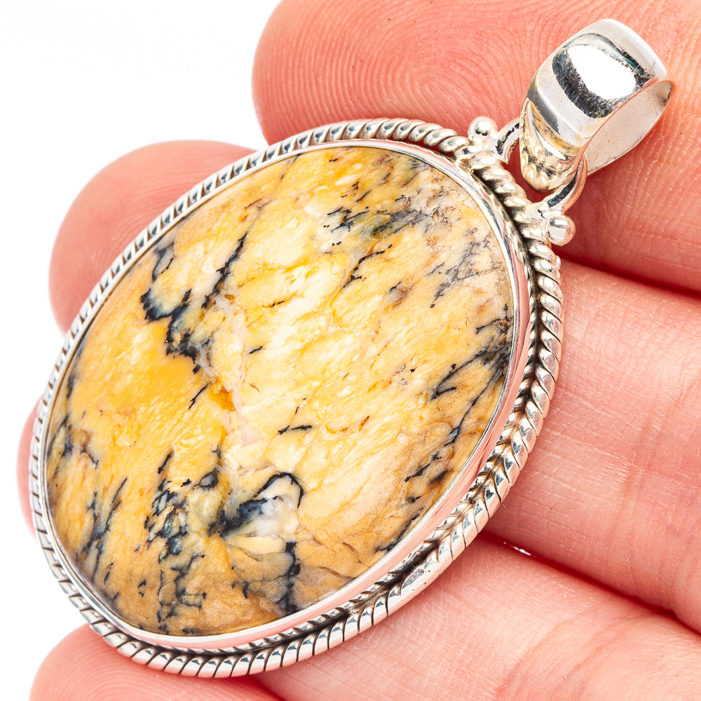 Yellow dendrite opal oval pendant in polished 925 sterling silver bezel and bail