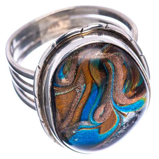 Iridescent oval dichroic glass ring with .925 sterling silver band, swirl design