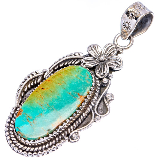 Turquoise oval pendant in detailed sterling silver setting with leaf-and-flower accents, bail
