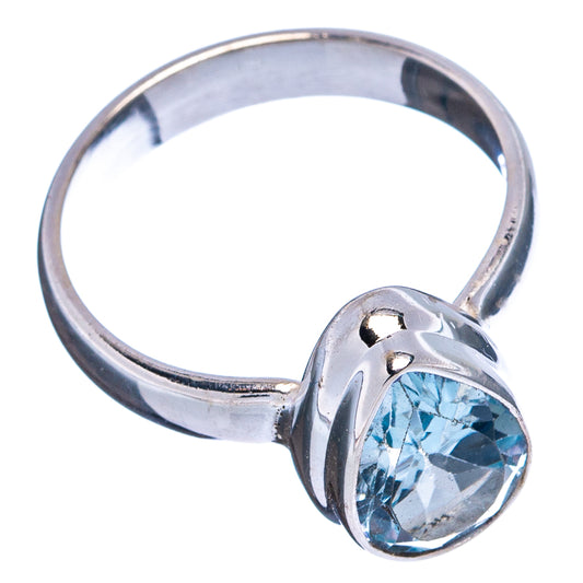 Sterling silver ring with faceted blue topaz center stone, rounded bezel setting