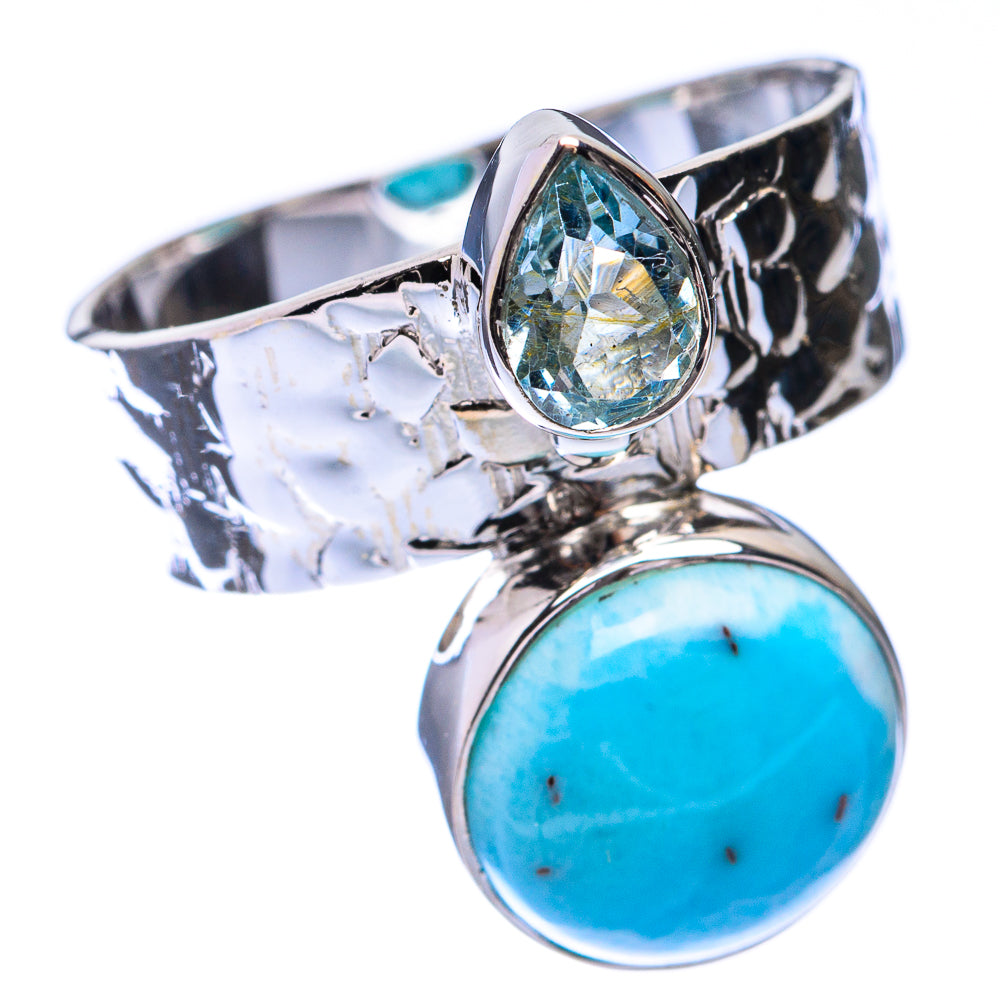 Sterling silver ring with bezel-set oval blue topaz and round blue larimar