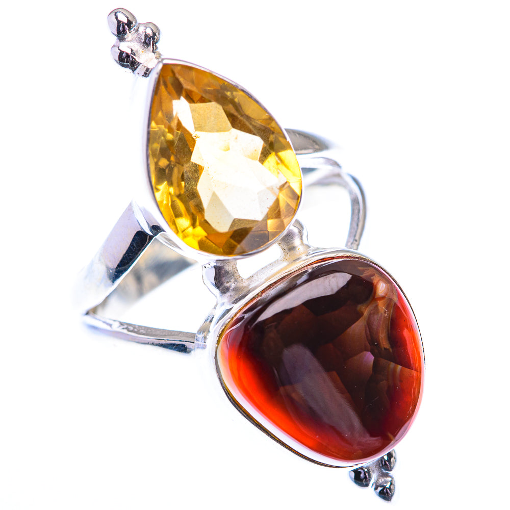 Sterling silver ring with pear-shaped yellow stone and oval dark red stone