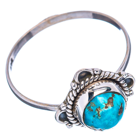 Sterling silver ring with turquoise oval cabochon and curled rope band detail