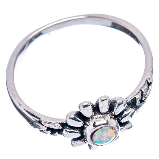 Sterling silver dainty flower ring with opal-like center stone, side view