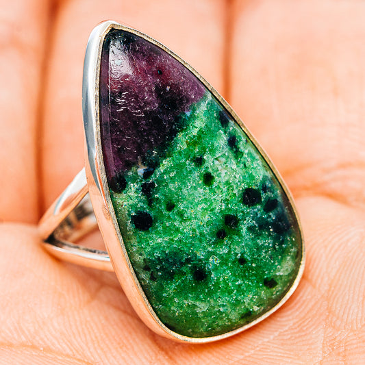Sterling silver oval gemstone ring with bezel-set green and dark purple speckled stone
