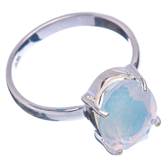 Sterling silver opal ring with oval light-blue cabochon and four-prong bezel