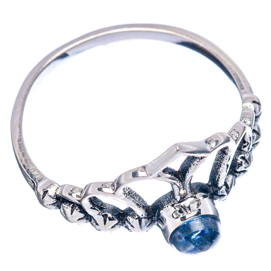 Sterling silver crown ring with blue kyanite cabochon and cutout band detail