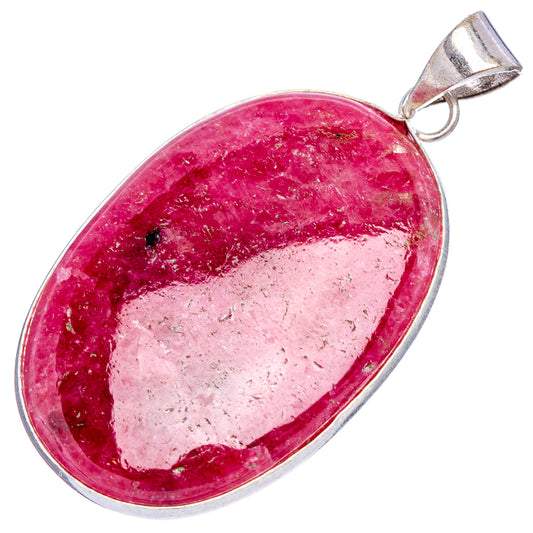Rhodonite pendant showing pink teardrop stone with silver bail