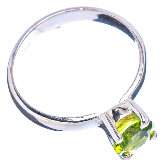 Sterling silver ring with faceted peridot side stone and open prong band
