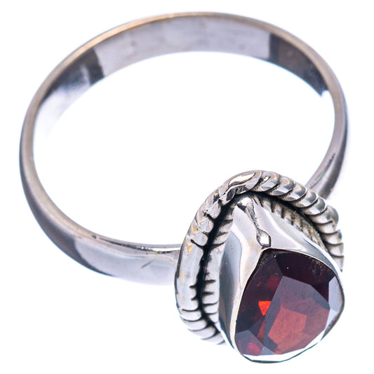 Oval faceted garnet set in .925 sterling silver ring with braided bezel and open shank