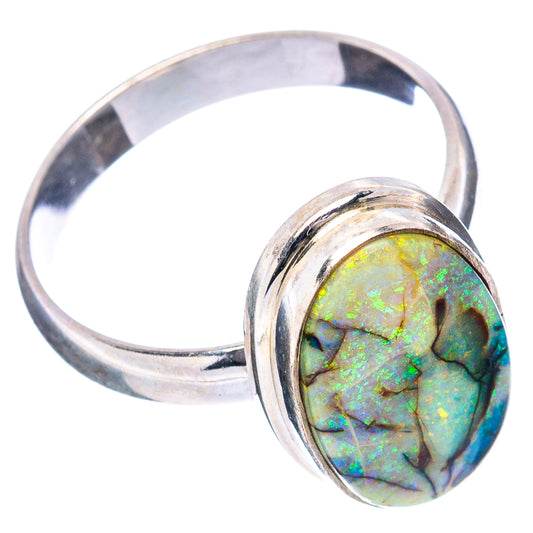 Sterling silver opal ring with oval green-blue gemstone and wide rounded band