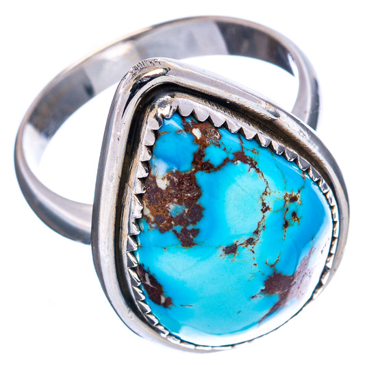 Turquoise cabochon statement ring in polished silver with decorative side bezel