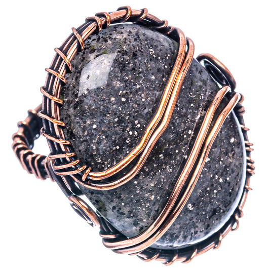 Oxidized copper wire wrap ring with black oval stone and layered copper rows
