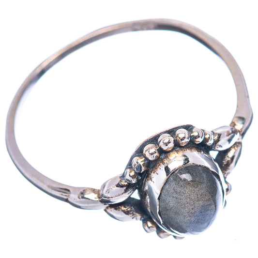 Sterling silver labradorite ring with raised beaded setting and oval dark stone