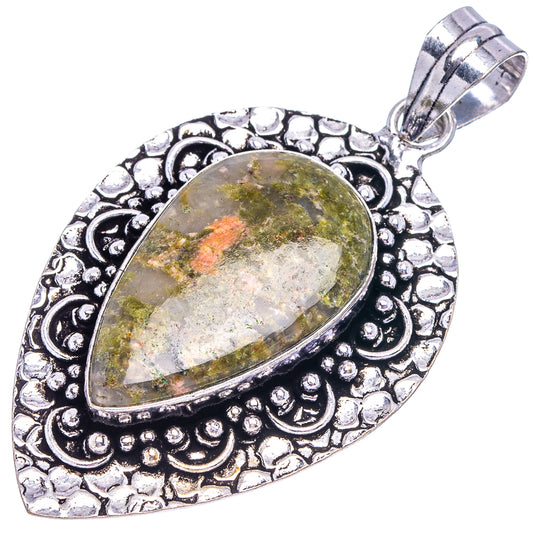 Oval unakite pendant in German silver, etched leaf border and looped bail top