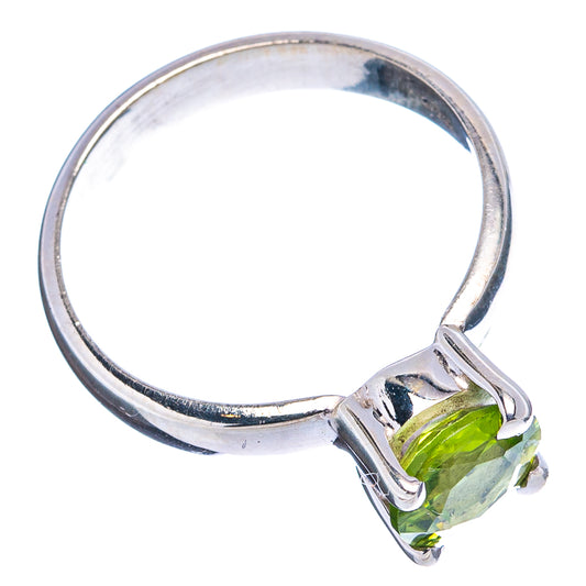 Sterling silver peridot ring with green faceted stone and prong-style basket