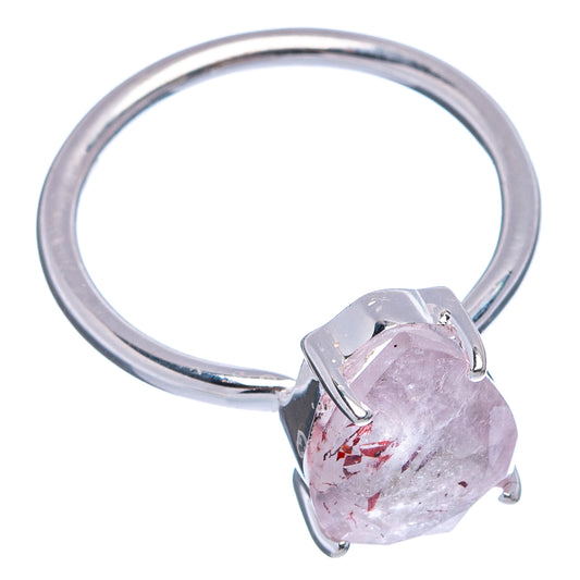 Sterling silver ring with faceted pear-cut clear gemstone and red speckles