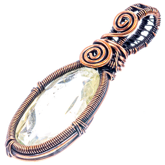 Green amethyst wire-wrap pendant with oxidized copper swirl frame and teardrop.