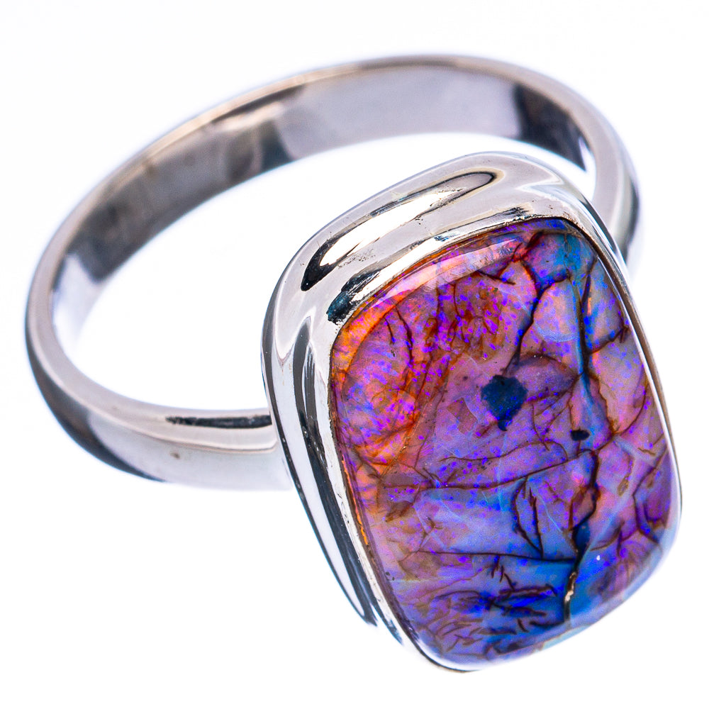 Sterling silver opal ring featuring blue-purple oval cabochon in raised bezel
