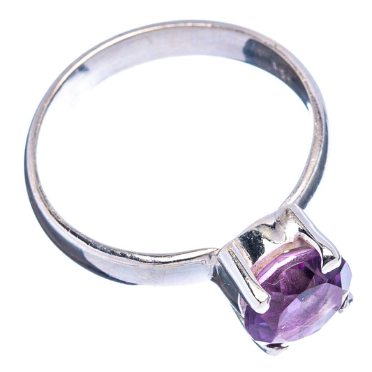 Sterling silver amethyst ring with faceted purple gemstone and open, polished band