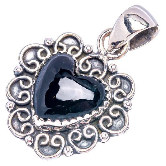 Sterling silver heart pendant with black onyx center and swirling filigree border