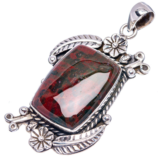 Sterling silver bloodstone pendant with oval red-green stone and side flower charms
