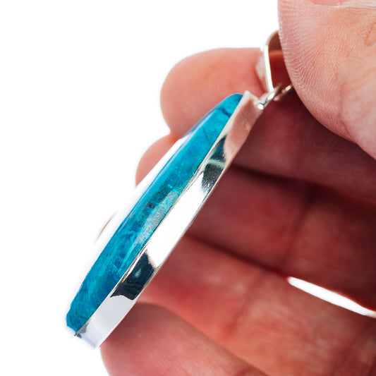Sterling silver shattuckite pendant side view with blue teardrop stone and bale