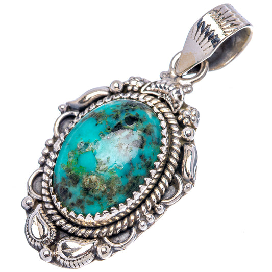 Turquoise oval pendant in decorative sterling silver bezel with scroll accents