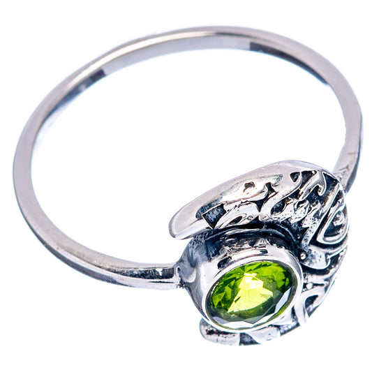 Sterling silver ring with round green peridot and ornate band details