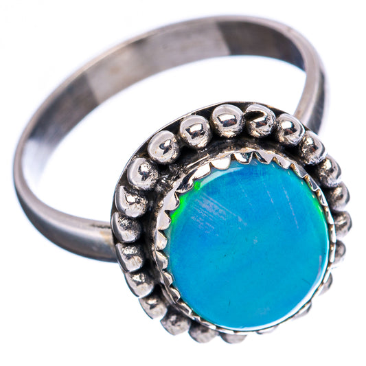 Sterling silver ring with blue oval opal center and raised bead detail around band