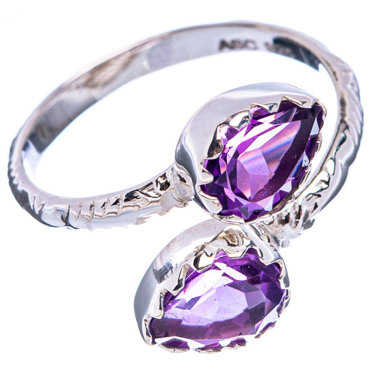 Sterling silver ring with two faceted amethyst teardrop stones, braided-style band.