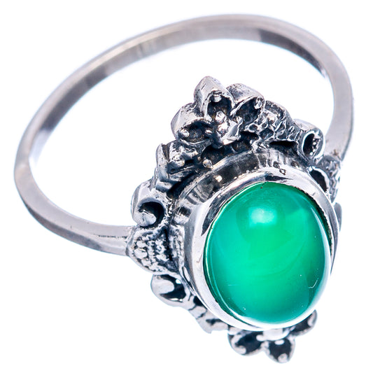 Sterling silver ring with green oval cabochon and floral bezel detail, size 6.75