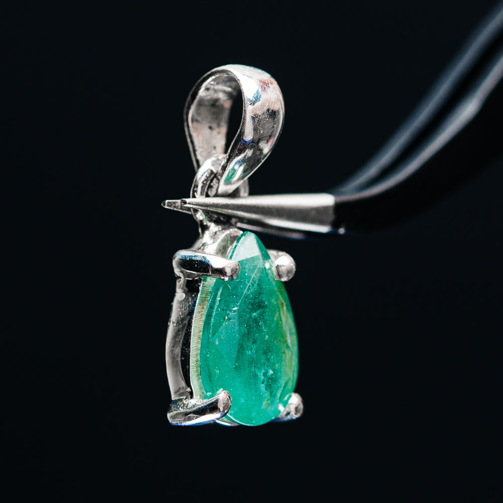 Sterling silver emerald pendant with open bail, pear-shaped green stone, side prongs